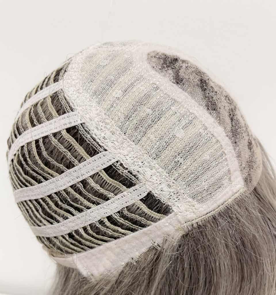 Lace front wig cap with hair strands for wig construction.